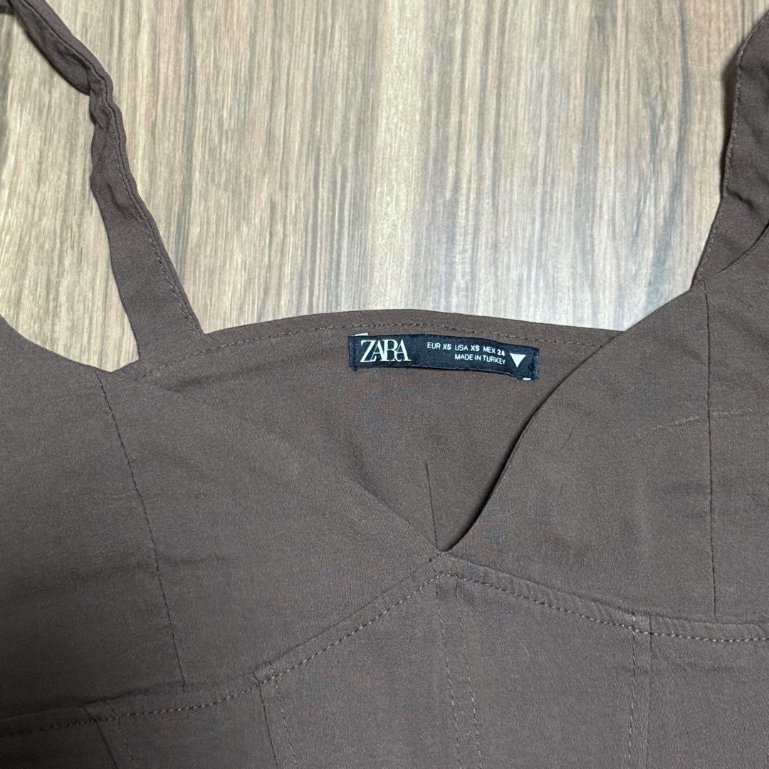 ZARA Brown Corset Top (Category: Sleeveless) located in Binangonan. Submitted by curatedbyjuys (Listing ID 1464261578, Image 3). Description: - Brown corset top from ZARA - Features a sweetheart neckline - Structured bodice with boning details - Highly versatile: dress up or down - Pairs well with jeans or skirts - Comfortable and stylish design.