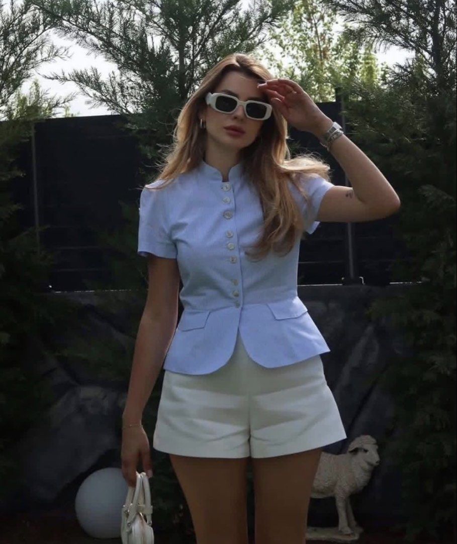 Zara Button-Up Blouse with Collar (Category: Blouses) located in Manila. Submitted by mazhktis.ndhdjssj79 (Listing ID 1464256226, Image 1). Description: Worn once, fixed price - Short sleeves - Structured fit - Mandarin collar - Button-up front - Pairs well with shorts or skirts - Ideal for a chic, put-together spring/summer look.