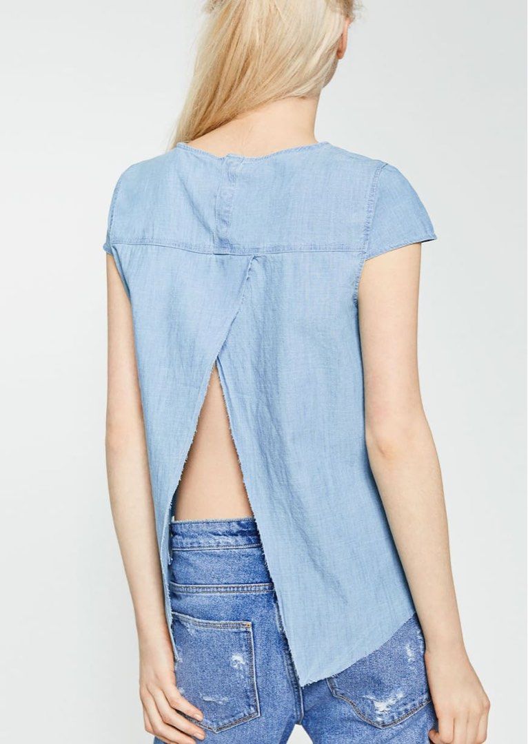 Zara Denim Chambray Split Back Top (Category: Sleeveless) located in Makati City. Submitted by moneybunny (Listing ID 1464154459, Image 2). Description: - Light wash denim top - Authentic Zara - Round neckline - Split back detail - Raw hem on bottom - Small front pocket -Flaw: discoloration or fading but not super obvious (see last pic) .