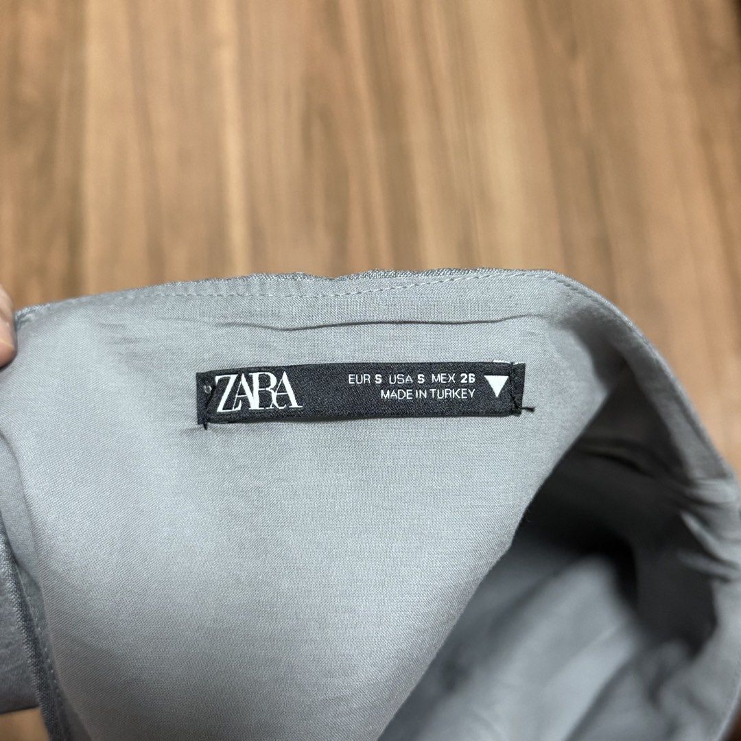 Zara Grey Tie Halter Top Size S (Category: Sleeveless) located in Binangonan. Submitted by curatedbyjuys (Listing ID 1464192911, Image 3). Description: - Zara grey halter top - Features a tie neck detail - Side zip closure for easy wear - Made from a structured material - Brand new, never worn (cut tag only) - Perfect for dressing up or down.