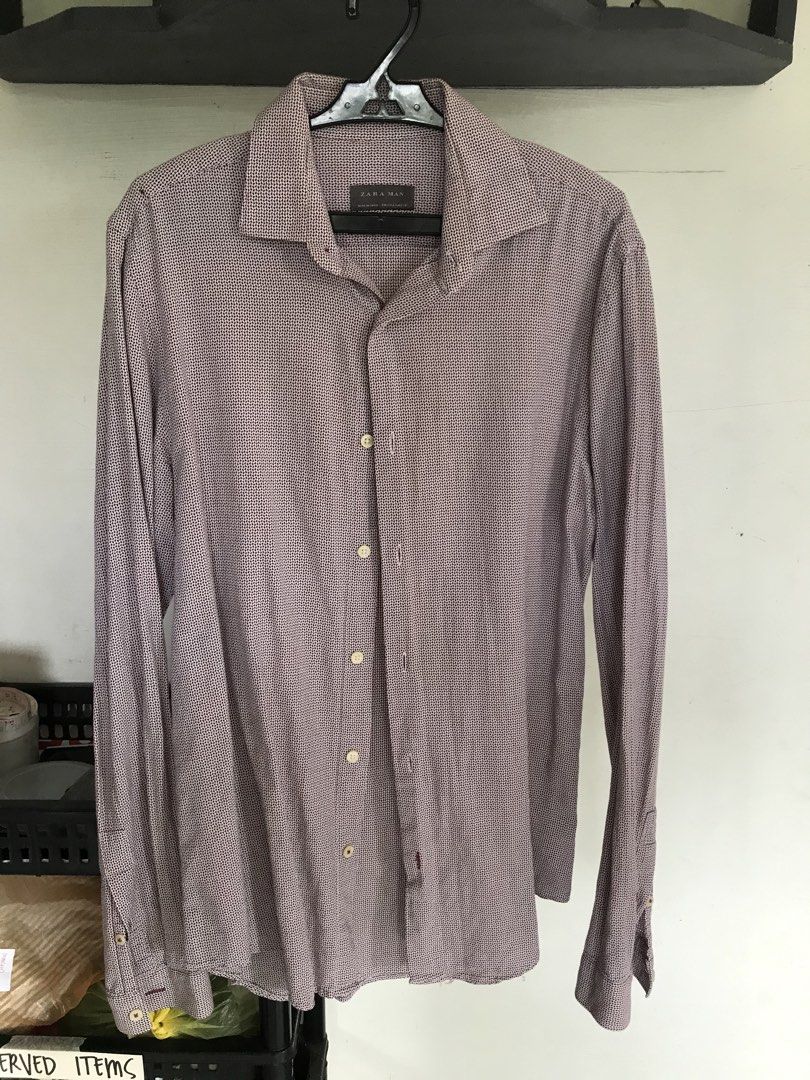 Zara Man Long Sleeve Button Up Shirt (Category: Tshirts & Polo Shirts ) located in Banga. Submitted by jorguarino (Listing ID 1464176074, Image 1). Description: - Zara Man Long Sleeve Shirt - Striking burgundy and white geometric pattern - Classic button-up front - Made in Spain - Size: EUR S / USA S / MEX 28 - Perfect for smart casual occasions.