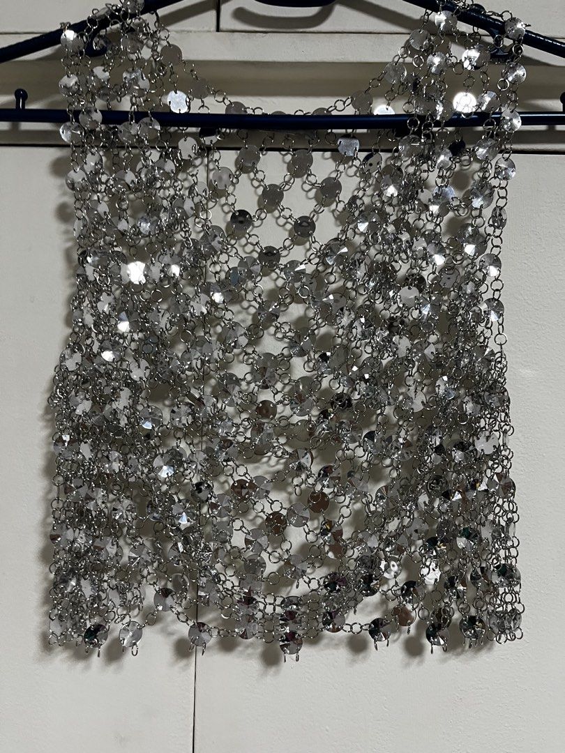 Zara Silver Chainmail Top (Category: Sleeveless) located in Manila. Submitted by lorenasant37621 (Listing ID 1464215768, Image 1). Description: - Sparkly silver chainmail top from Zara - Features many small circular metals linked together - Ideal for parties or festivals - Adds significant shine to any outfit - Unique and eye-catching piece.