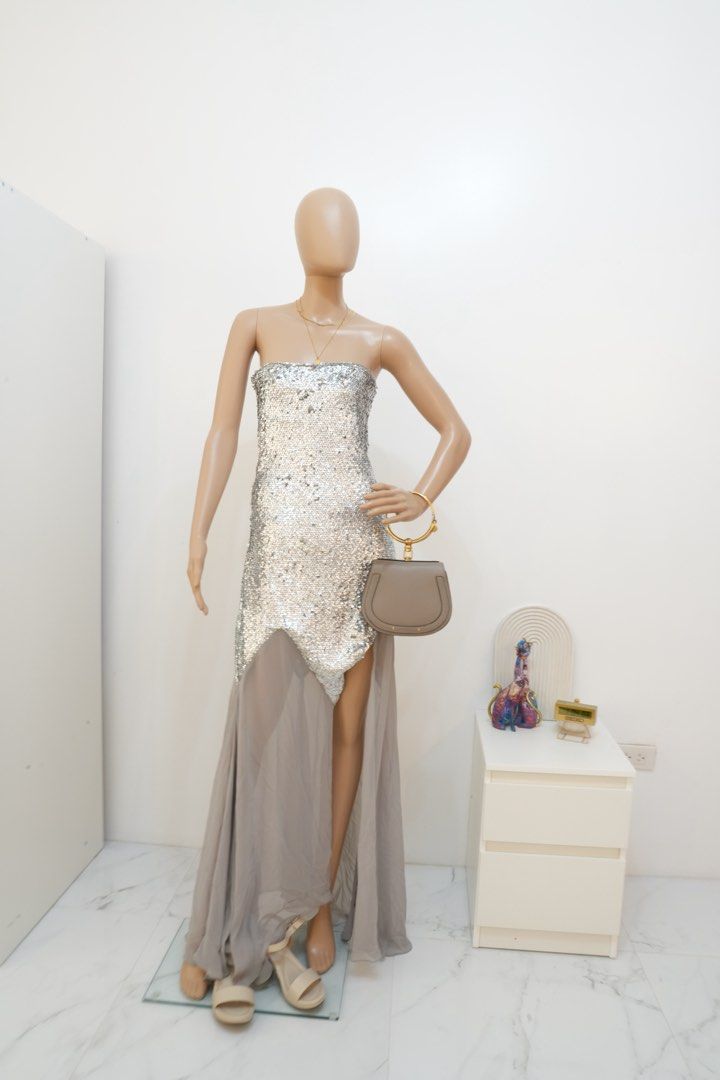 Zara x Barbie Sequined Gown (Category: Evening dresses & gowns) located in San Nicolas. Submitted by ihascat (Listing ID 1464150417, Image 1). Description: - Dazzling sequin bodice - Strapless design - Flowing sheer overlay skirt - High slit for a dramatic look - Unique asymmetrical hemline - Perfect for parties and special events - Guaranteed to turn heads!.
