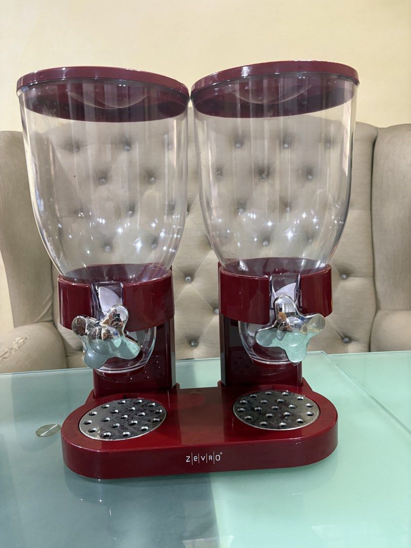 Zevro Double Cereal Dispenser Red (Category: Food Organization & Storage) located in Manila. Submitted by dig76 (Listing ID 1464197194, Image 1). Description: - Red double cereal dispenser - Keeps cereal fresh and dispenses easily with a knob turn - Great for pantry organization and reducing clutter - Each canister holds a generous amount of cereal - Sturdy base for stability - Easy to refill from the top.