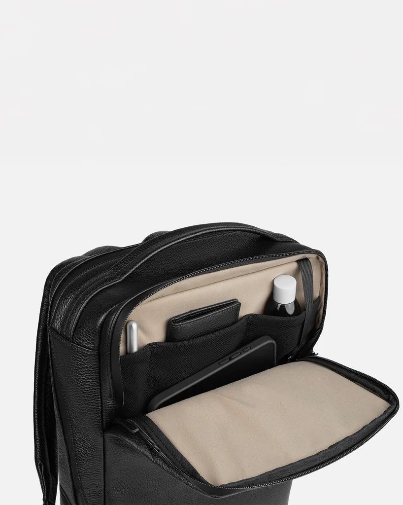 150 Daypack by GRAMS28 (Category: Luxury Bags & Wallets) located in Manila. Submitted by gargonate (Listing ID 1464493536, Image 2). Description: 150 Daypack A slim yet practical backpack ideal for work. From the office to the road, this bag is always business-ready. - Sleek black leather backpack - Dedicated laptop sleeve - Multiple organizer pockets inside - Side passport pocket - Strap to slide onto luggage handles - Great for work or travel P