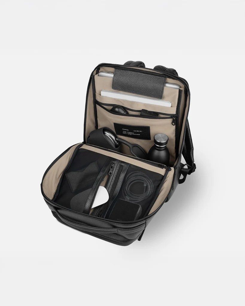 150 Daypack by GRAMS28 (Category: Luxury Bags & Wallets) located in Manila. Submitted by gargonate (Listing ID 1464493536, Image 3). Description: 150 Daypack A slim yet practical backpack ideal for work. From the office to the road, this bag is always business-ready. - Sleek black leather backpack - Dedicated laptop sleeve - Multiple organizer pockets inside - Side passport pocket - Strap to slide onto luggage handles - Great for work or travel P