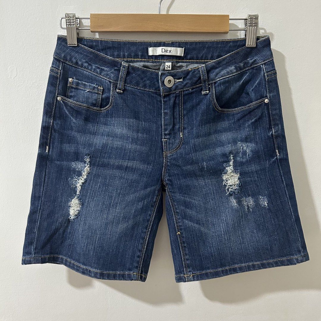 [29”] DEX Low Rise Stretch Distressed Bermuda Denim Shorts (Category: Shorts) located in Tanza. Submitted by shop_qrated (Listing ID 1464444372, Image 3). Description: DEX Low Rise Stretch Distressed Bermuda Denim Shorts. Measures 29” low rise via medida sizing. Dark wash denim bermuda shorts from Dex. Features a distressed design with ripped details. Has a button and YKK zipper closure. The shorts have pockets in the front and back. Made of 99.4