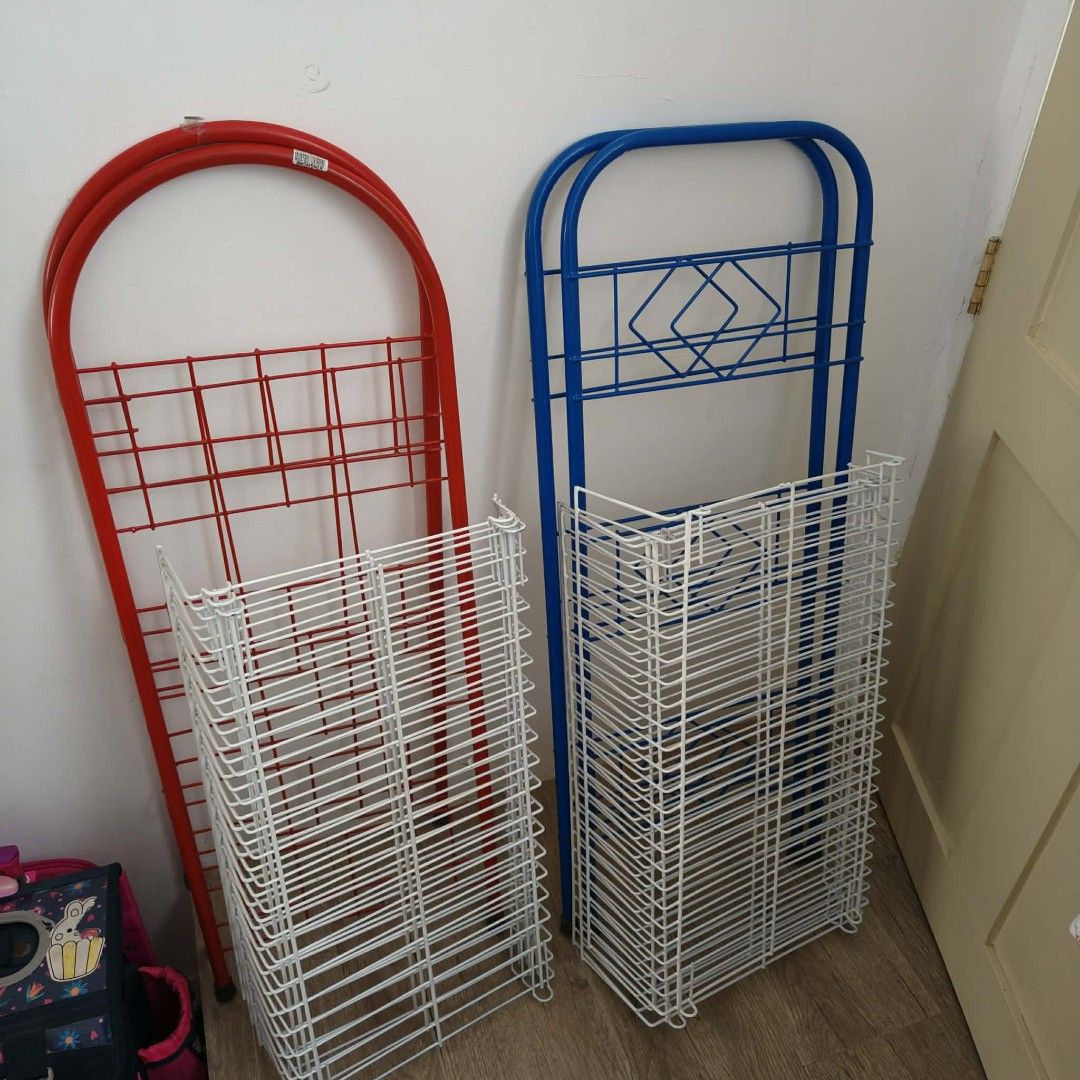 2x Wire Shelving Racks - Red and Blue Metal Frames (Category: Shelves, Cabinets & Racks) located in Manila. Submitted by declutterer1009 (Listing ID 1464491265, Image 3). Description: - Set of 2 sturdy wire shelving racks - One blue frame, one red frame - Multiple shelves per rack - Excellent for storage or display purposes - Red rack has original price tag of ₱1,067.00.
