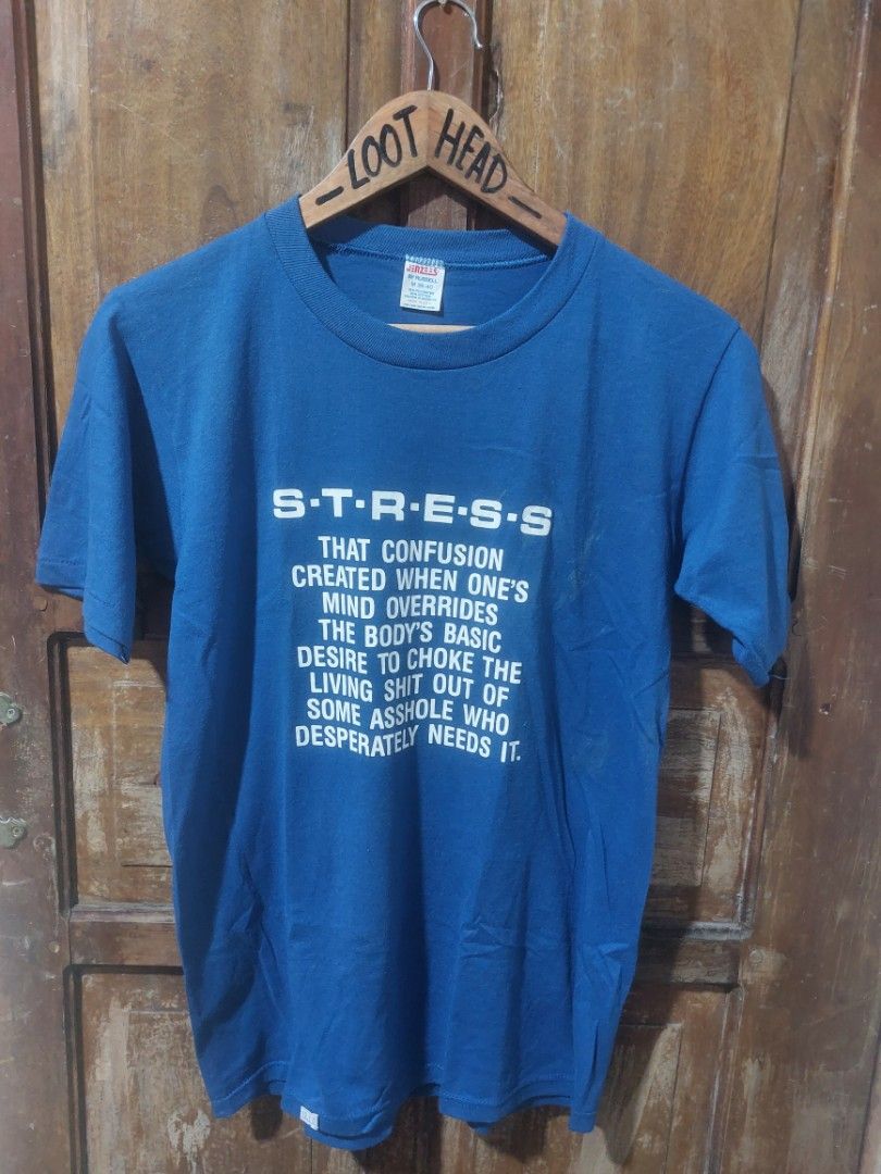 80s Jerzees "STRESS" Graphic T-Shirt (Category: Tshirts & Polo Shirts ) located in Magarao. Submitted by hotdogsandwich.flower (Listing ID 1464384970, Image 1). Description: - Brand: Jerzees - Color: Blue - Graphic Print: Spells 'STRESS' with definition - Material: 50% Cotton, 50% Polyester - Size: Medium (M) - Condition: Faint marks on the front (please check photos for details).