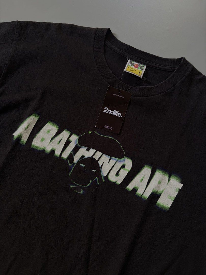A Bathing Ape BAPE Tee - Size L (Category: Tshirts & Polo Shirts ) located in Midsayap. Submitted by monesreenc98619 (Listing ID 1464404364, Image 3). Description: - Authentic Black A Bathing Ape (BAPE) T-Shirt - Features iconic ape head logo with a unique glitch effect graphic - Size: Large (L) - Condition: Brand new with original tags and a 2ndlife.com tag - Perfect addition to any streetwear or BAPE enthusiast's collection.