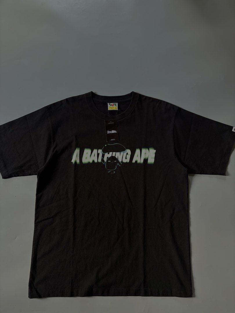 A Bathing Ape BAPE Tee - Size L (Category: Tshirts & Polo Shirts ) located in Midsayap. Submitted by monesreenc98619 (Listing ID 1464404364, Image 1). Description: - Authentic Black A Bathing Ape (BAPE) T-Shirt - Features iconic ape head logo with a unique glitch effect graphic - Size: Large (L) - Condition: Brand new with original tags and a 2ndlife.com tag - Perfect addition to any streetwear or BAPE enthusiast's collection.