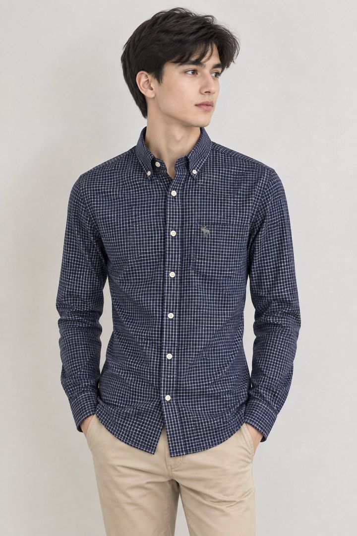 Abercrombie & Fitch Button Down Shirt Size S (Category: Tshirts & Polo Shirts ) located in Quezon City. Submitted by soloqueenph (Listing ID 1464411578, Image 1). Description: - Brand: Abercrombie & Fitch - Color: Navy blue and white checkered - Size: Tagged S - Features: Small embroidered moose logo on chest pocket, button collar, long sleeves with button cuffs - Condition: Great for casual or smart-casual wear .