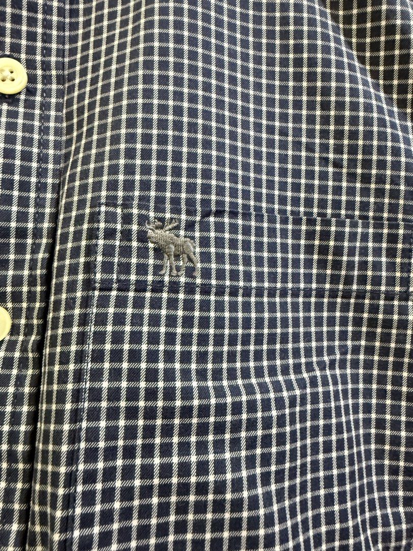 Abercrombie & Fitch Button Down Shirt Size S (Category: Tshirts & Polo Shirts ) located in Quezon City. Submitted by soloqueenph (Listing ID 1464411578, Image 3). Description: - Brand: Abercrombie & Fitch - Color: Navy blue and white checkered - Size: Tagged S - Features: Small embroidered moose logo on chest pocket, button collar, long sleeves with button cuffs - Condition: Great for casual or smart-casual wear .