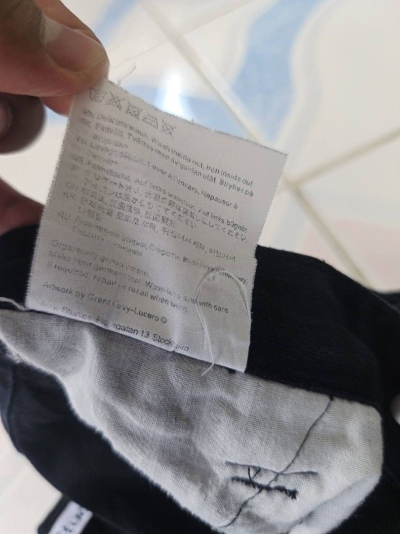 Acne Studios Black Baggy Cargo Pants (Category: Jeans) located in Manila. Submitted by cookthrift (Listing ID 1464371792, Image 3). Description: - Brand: Acne Studios - Color: Black - Fit: Wide leg - Closure: Zip fly - Details: Multiple pockets with buckle accents on legs - Artwork: By Grant Levy-Lucero - Origin: Made in Portugal - Size: 27 tape measure length 41.5 9.5 leg opening no issue excellent .