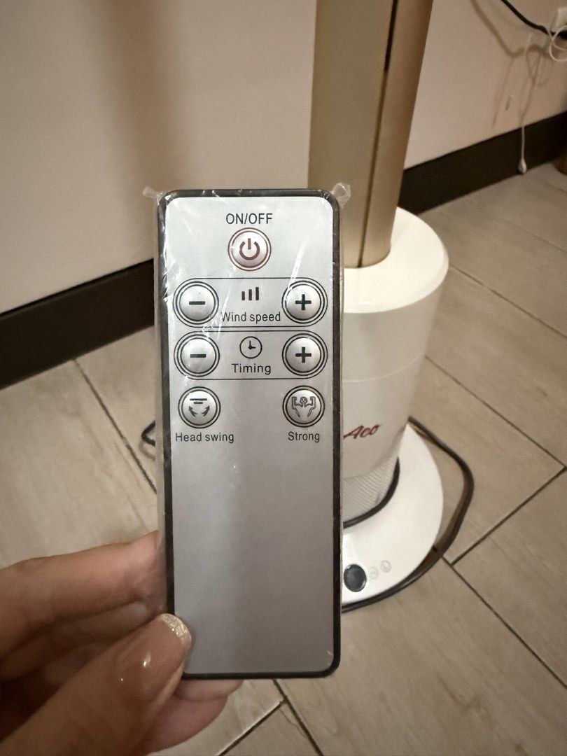 Aco Tower Fan with Remote Control (Category: Fans) located in Makati City. Submitted by rilachan6666 (Listing ID 1464512642, Image 3). Description: - Sleek white and gold Aco tower fan - Includes convenient remote control - Adjustable wind speed settings - Timer function for customized use - Strong mode for powerful cooling - Head swing function for wider air distribution - Perfect for keeping your room cool and comfortable Original price: ₱8,800
