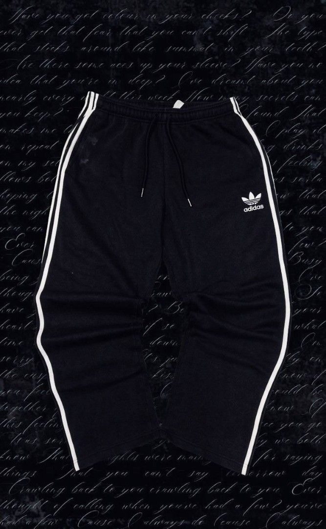 Adidas Black Track Pants with White Stripes (Category: Joggers) located in Manila. Submitted by darkdezire777 (Listing ID 1464414436, Image 1). Description: - Classic black Adidas track pants - Iconic white stripes down the sides - Features the Adidas logo - Comfortable drawstring waist - Ideal for casual wear or sports activities.