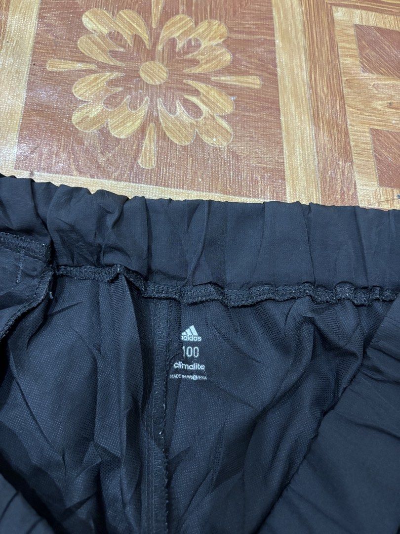 Adidas Climalite Black Track Pants Size 100 (Category: Joggers) located in Manila. Submitted by noribrahim.20 (Listing ID 1464507240, Image 2). Description: - Black Adidas track pants - Climalite material for breathability - Elastic waistband with drawstring - Zippers at the ankle - Made in Indonesia - Size 100 Issue See last picture .