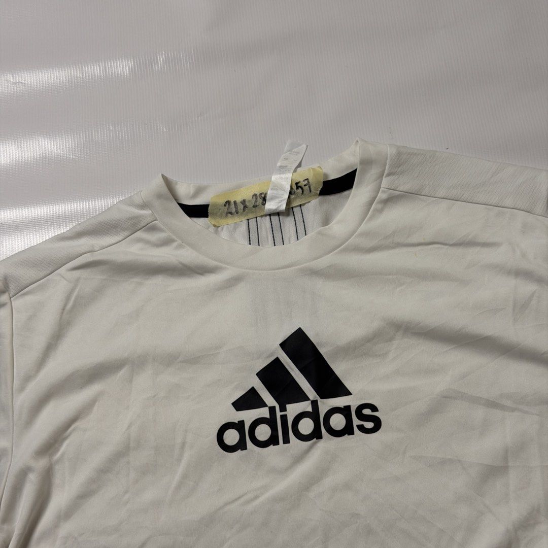 Adidas Primeblue T-shirt White (Category: Tshirts & Polo Shirts ) located in Manila. Submitted by johnedel_james (Listing ID 1464540188, Image 2). Description: - White Adidas T-shirt - Size: A/M (175/96A) - Material: Primeblue, made with Parley Ocean Plastic - Design: Classic Adidas logo on front, three stripes on back - Ideal for: Sports or casual wear.