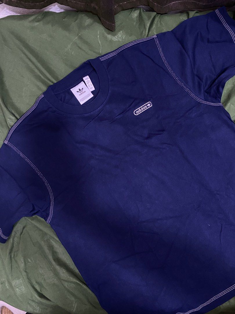 Adidas T-Shirt Navy Blue Size M (Category: Shirts) located in Manila. Submitted by cyyruss (Listing ID 1464374550, Image 2). Description: - Classic navy blue Adidas t-shirt -ORIGINAL FROM UAE - Features a subtle, small Adidas logo on the chest - Stylish contrast stitching along the seams - Made from comfortable, breathable cotton material - Ideal for casual everyday wear.