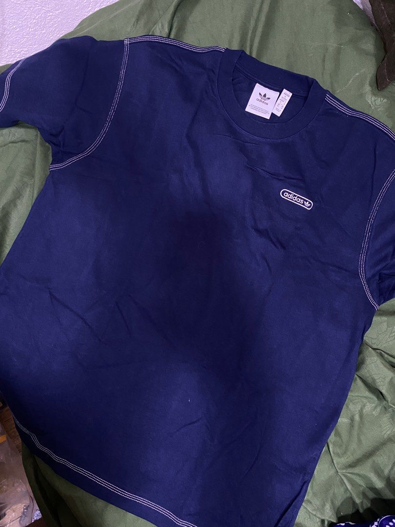 Adidas T-Shirt Navy Blue Size M (Category: Shirts) located in Manila. Submitted by cyyruss (Listing ID 1464374550, Image 1). Description: - Classic navy blue Adidas t-shirt -ORIGINAL FROM UAE - Features a subtle, small Adidas logo on the chest - Stylish contrast stitching along the seams - Made from comfortable, breathable cotton material - Ideal for casual everyday wear.