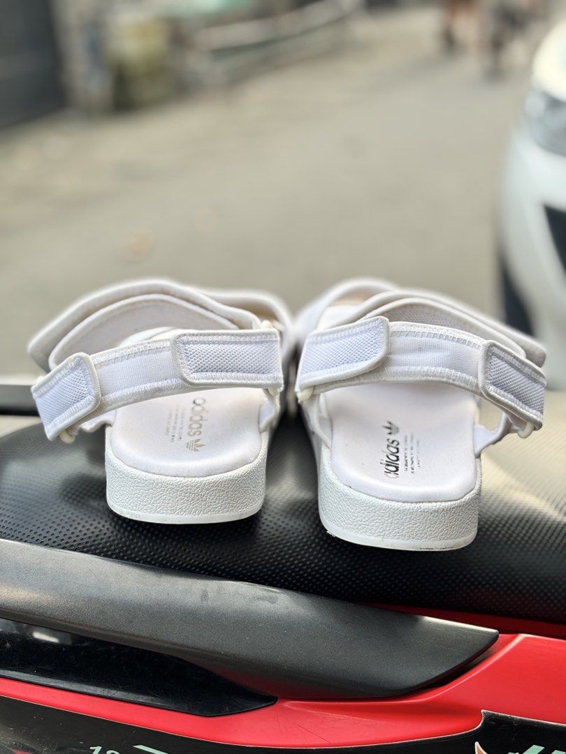 Adidas White Men's Sandals Size 10 (Category: Slippers & Slides) located in San Fernando. Submitted by kickslocker (Listing ID 1464369599, Image 3). Description: - White Adidas slides for men - Size 10 (28.5cm) - Adjustable straps for a comfortable fit - Ideal for casual outings or beach days - Comfortable and stylish.