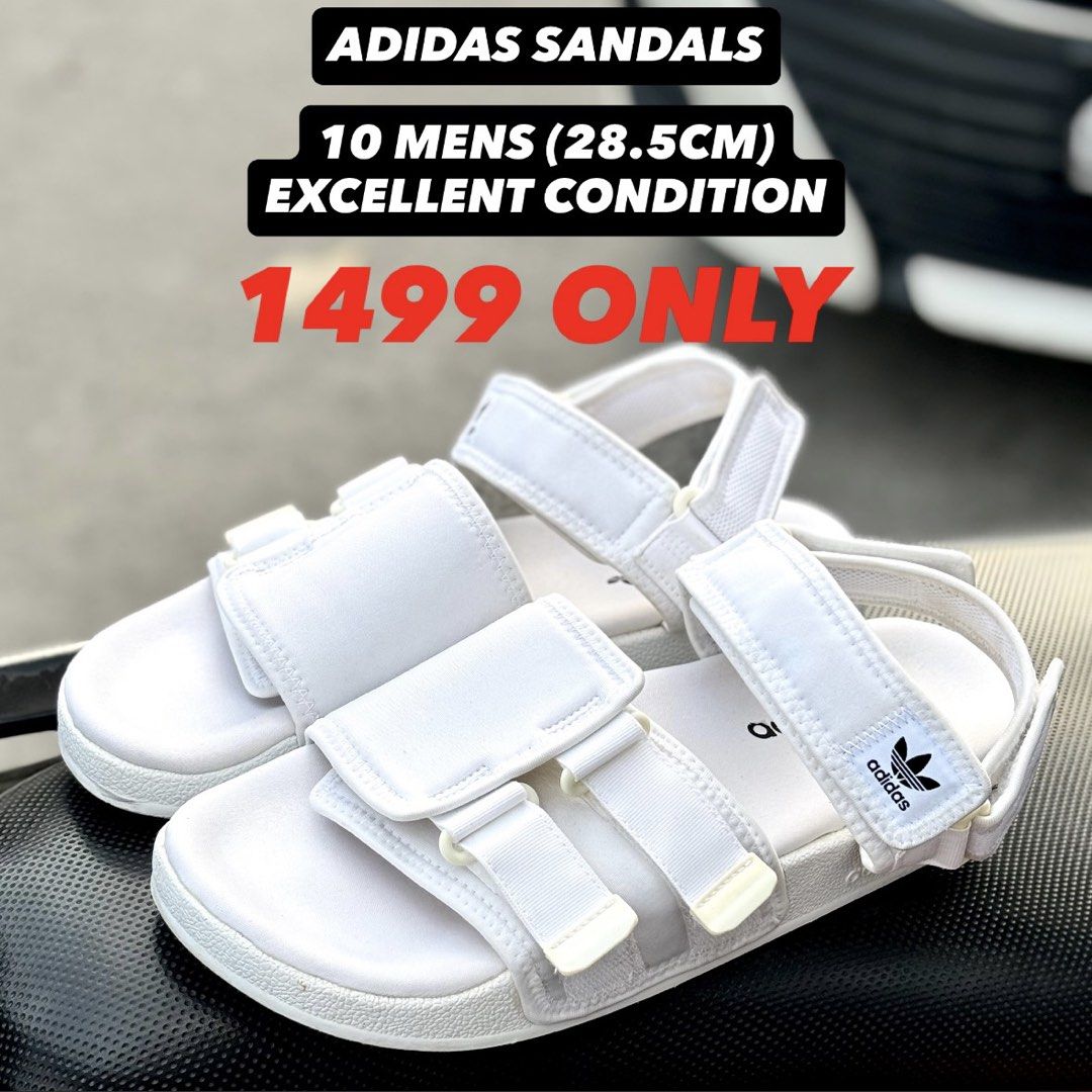 Adidas White Men's Sandals Size 10 (Category: Slippers & Slides) located in San Fernando. Submitted by kickslocker (Listing ID 1464369599, Image 1). Description: - White Adidas slides for men - Size 10 (28.5cm) - Adjustable straps for a comfortable fit - Ideal for casual outings or beach days - Comfortable and stylish.