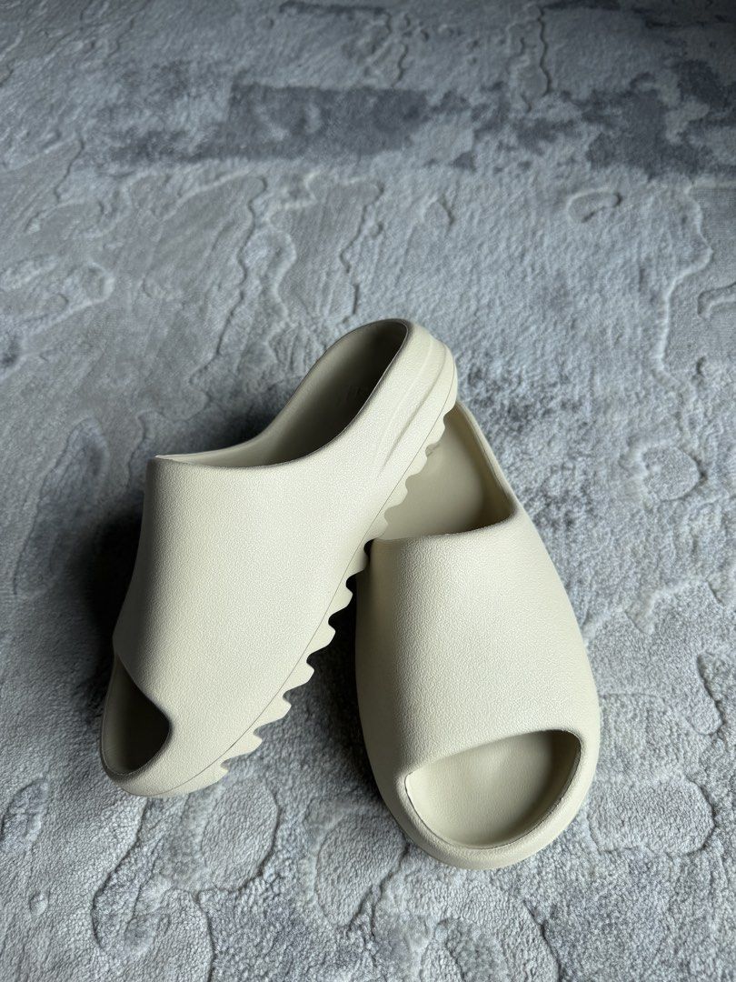 Adidas Yeezy Slide Bundle (Bone + Onyx) (Category: Slippers & Slides) located in Manila. Submitted by handoverfist (Listing ID 1464393455, Image 2). Description: But both for 7,200 with free shipping Original No boxes No low ballers please .