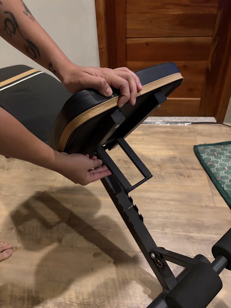 Adjustable Weight Bench for Home Gym Workouts (Category: Weights & Dumbbells) located in Quezon City. Submitted by badussy (Listing ID 1464540126, Image 3). Description: - Versatile weight bench for your home gym - Easily adjustable backrest and seat for various exercises - Padded foam rollers for comfortable leg workouts - Sturdy metal frame for durability - Folds for convenient storage - Ideal for strength training and fitness routines.