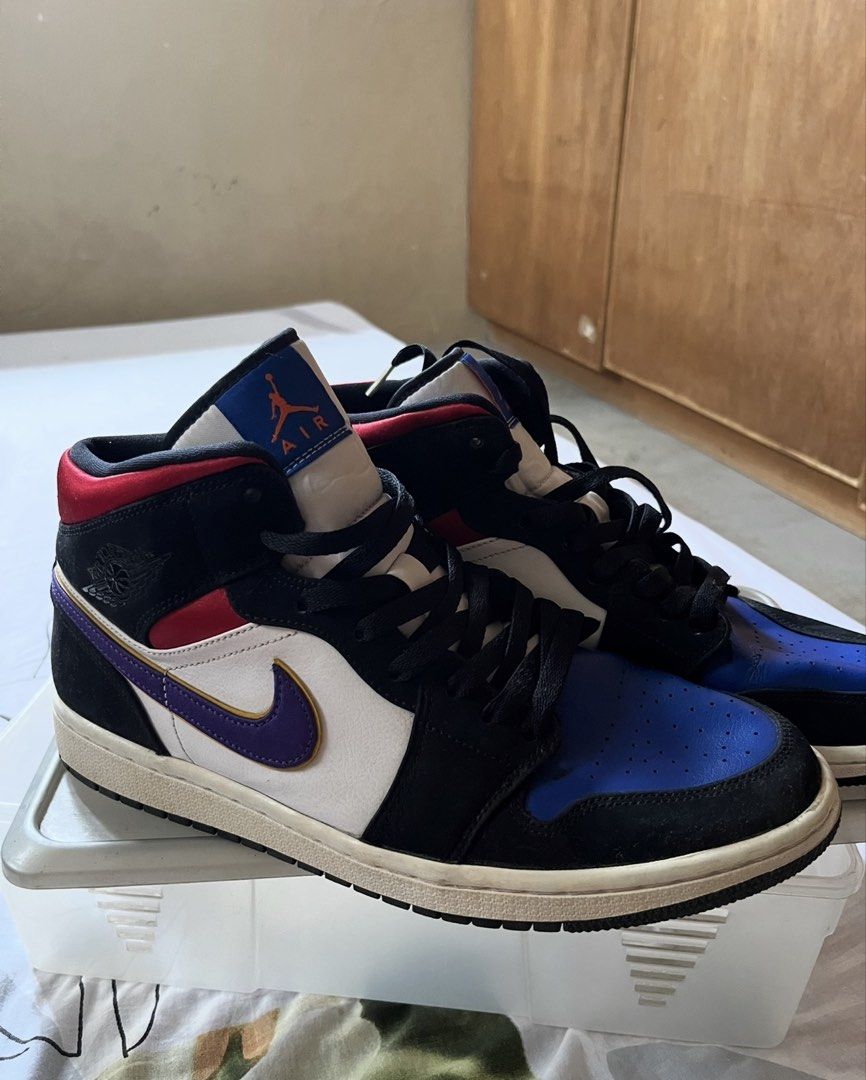 Air Jordan 1 Mid SE 'Rivals' (Category: Sneakers) located in Mexico. Submitted by studioleraph (Listing ID 1464418713, Image 2). Description: Air Jordan 1 Mid SE ‘Rivals’ US 11 No Box Used - Please Manage expectations RFS: Not being used * Type: High-top basketball sneaker * Style: Air Jordan 1 High silhouette * Upper: Leather with textile tongue/collar * Colorway: Black / White / Royal Blue / Red / Purple * Toe box: Perforated royal-blue leather