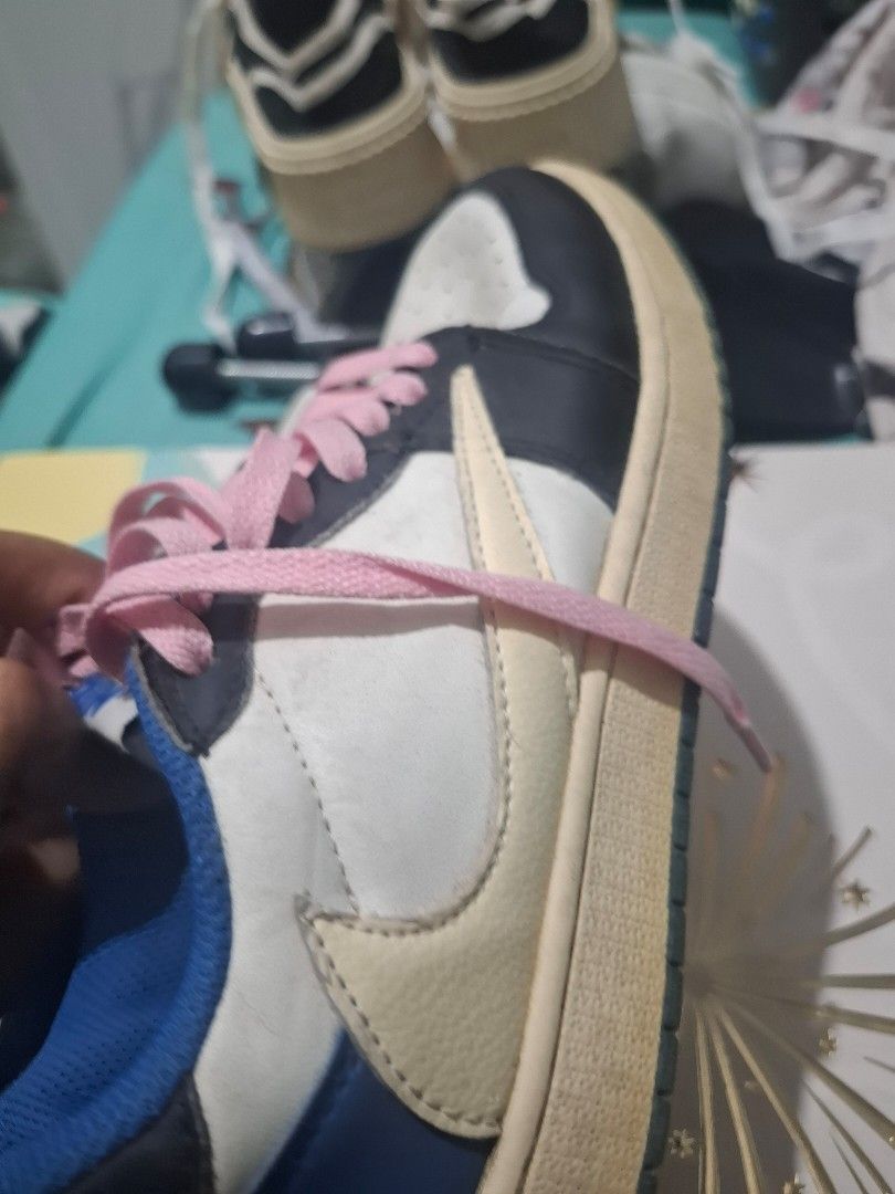 Air Jordan 1 Travis Scott (Category: Sneakers) located in Marikina City. Submitted by bags21.ph (Listing ID 1464485382, Image 3). Description: - Travis Scott Jordan 1s - Includes original laces and extra pink laces - Midsole shows some yellowing - With flaws at the back of one shoe.