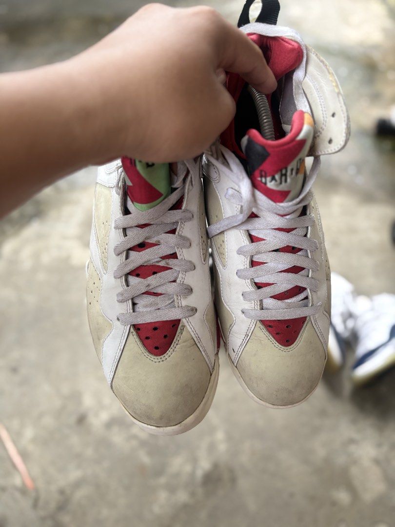Air Jordan 7 Retro "Hare" White Red (Category: Sneakers) located in Marikina City. Submitted by kuyamosafe (Listing ID 1464400085, Image 3). Description: - Authentic Air Jordan 7 Retro 'Hare' sneakers - Classic white and red colorway - Features iconic 'Hare' print on tongue - Jumpman logo and '23' on heel - Soles have some wear but good tread remaining - Ideal for sneaker collectors or casual wear.