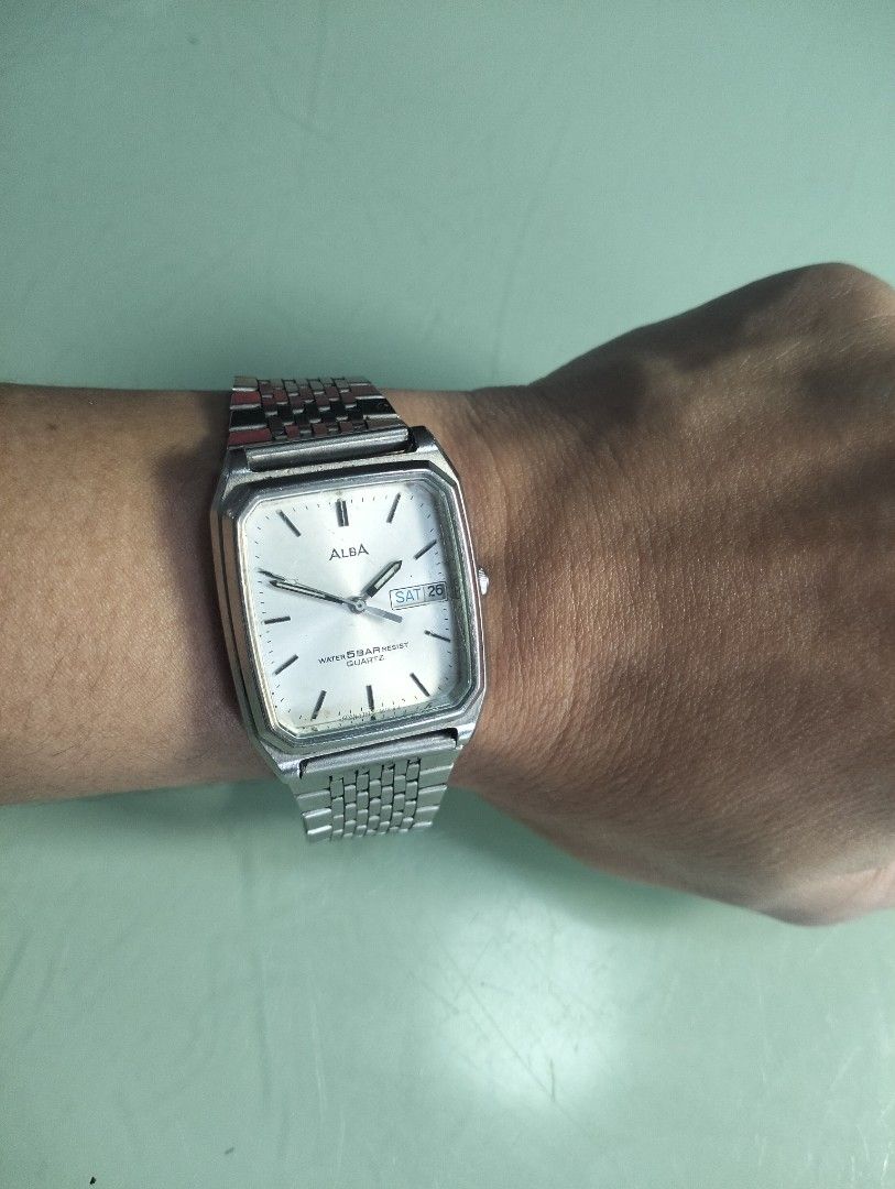Alba Quartz Watch Water Resist Day Date (Category: Men's Watches) located in General Mariano Alvarez. Submitted by ma.miafajardo1219 (Listing ID 1464421807, Image 3). Description: - Alba Quartz Watch - Silver-tone casing and metal strap - White dial with day and date display - Water resistant 5 bar - Fully functional, works well - Minor cosmetic scratches on watch face and casing tank type with new battery .
