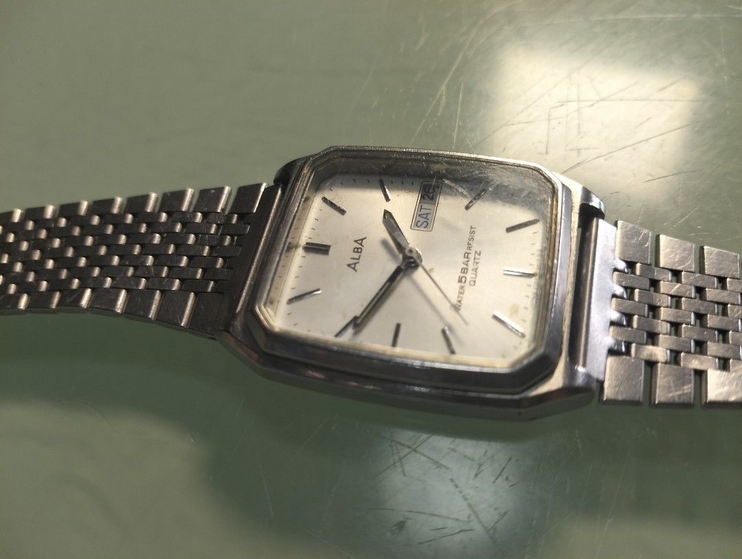 Alba Quartz Watch Water Resist Day Date (Category: Men's Watches) located in General Mariano Alvarez. Submitted by ma.miafajardo1219 (Listing ID 1464421807, Image 2). Description: - Alba Quartz Watch - Silver-tone casing and metal strap - White dial with day and date display - Water resistant 5 bar - Fully functional, works well - Minor cosmetic scratches on watch face and casing tank type with new battery .