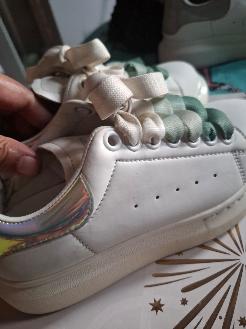 Alexander McQueen Oversized Sneaker White Iridescent Heel (Category: Sneakers) located in Marikina City. Submitted by bags21.ph (Listing ID 1464440279, Image 2). Description: - Authentic White Alexander McQueen Sneakers - Iconic oversized sole - Iridescent heel tab with branding - Comes with original white laces - Includes an extra set of green gradient laces - Size: 36 - Condition: Great.