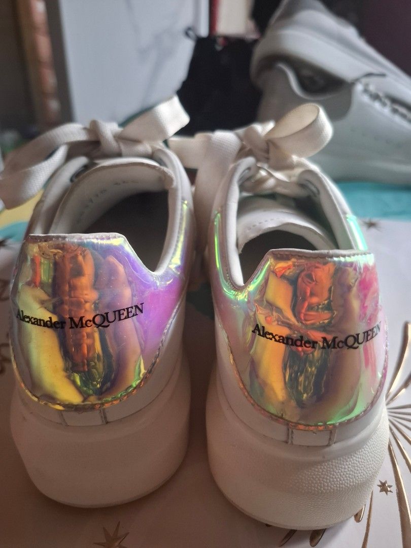 Alexander McQueen Oversized Sneaker White Iridescent Heel (Category: Sneakers) located in Marikina City. Submitted by bags21.ph (Listing ID 1464440279, Image 1). Description: - Authentic White Alexander McQueen Sneakers - Iconic oversized sole - Iridescent heel tab with branding - Comes with original white laces - Includes an extra set of green gradient laces - Size: 36 - Condition: Great.