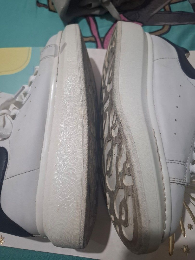 Alexander McQueen Oversized Sneakers White (Category: Sneakers) located in Marikina City. Submitted by bags21.ph (Listing ID 1464483891, Image 3). Description: - Authentic Alexander McQueen white leather sneakers - Features the signature oversized sole - Gold Alexander McQueen logo on the heel tab - Minor scuffs on sole and toe area - Plenty of life left, great for everyday wear.