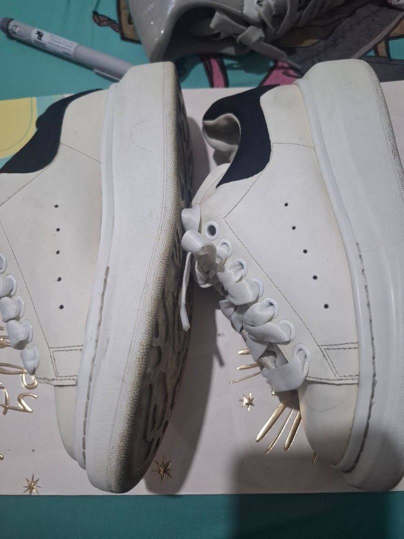 Alexander McQueen Oversized Sneakers White Black (Category: Sneakers) located in Marikina City. Submitted by bags21.ph (Listing ID 1464490380, Image 3). Description: - Authentic White Alexander McQueen Sneakers - Iconic Black Heel Tab - Chunky Platform Sole - White Laces - Minor scuffs on soles and leather from normal wear - Plenty of life left, great statement shoes - Yellowish part of the shoes.