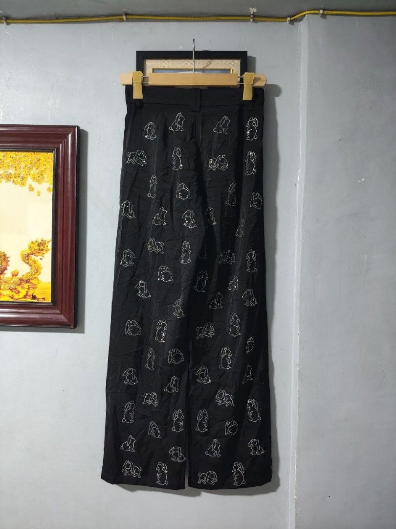 Alexander Wang Wide Leg Pants (Category: Luxury Apparel) located in Paranaque City. Submitted by reymart_1 (Listing ID 1464466028, Image 2). Description: Features with rhinestones rabbit along with black colorway -size 27 on waist -40 on length -wide leg -black colorway -elegant style -for bgc outfit -no missing rhinestone -no issue.