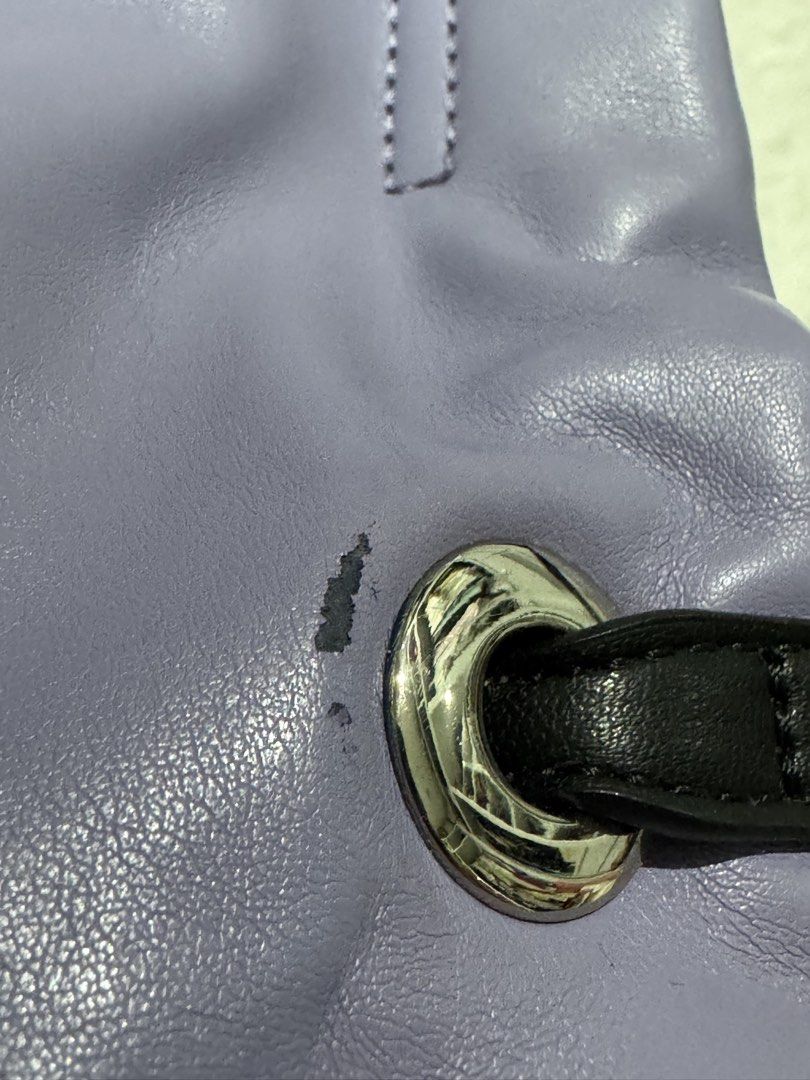 ANNA SUI Purple Leather Drawstring Handbag with Shoulder Strap (Category: Shoulder Bags) located in San Nicolas. Submitted by ihascat (Listing ID 1464449925, Image 2). Description: - Authentic ANNA SUI purple leather handbag - Drawstring closure - Black handles - Detachable black shoulder strap included - Great everyday size.