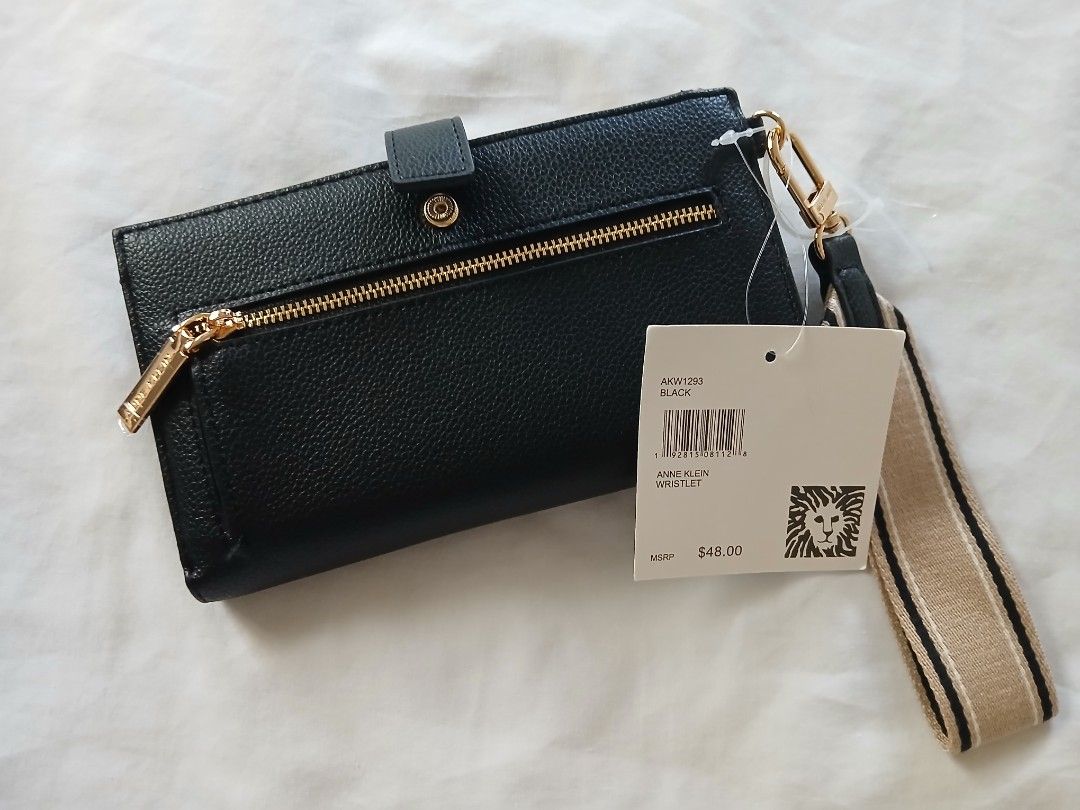 Anne Klein Black Wristlet Wallet with Strap (Category: Wallets & Card holders) located in Cavite. Submitted by gb1974 (Listing ID 1464379257, Image 2). Description: - BRAND NEW FRESH FROM THE USA!!! - Black Anne Klein wristlet - Front zip pocket - Snap closure - Multiple interior card slots - Clear ID window - Detachable strap - Original tag included (MSRP $48.00) - Ideal for organizing essentials.