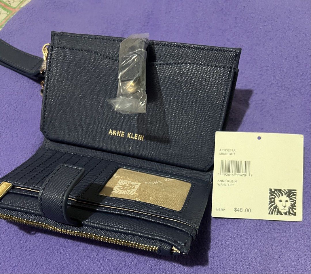 Anne Klein wristlet (Category: Luxury Bags & Wallets) located in Makati City. Submitted by transactwithme (Listing ID 1464465220, Image 2). Description: Anne Klein wristlet brand new Original price:48usd Color: navy blue Size H: 11cm L: 19cm W: 3cm.