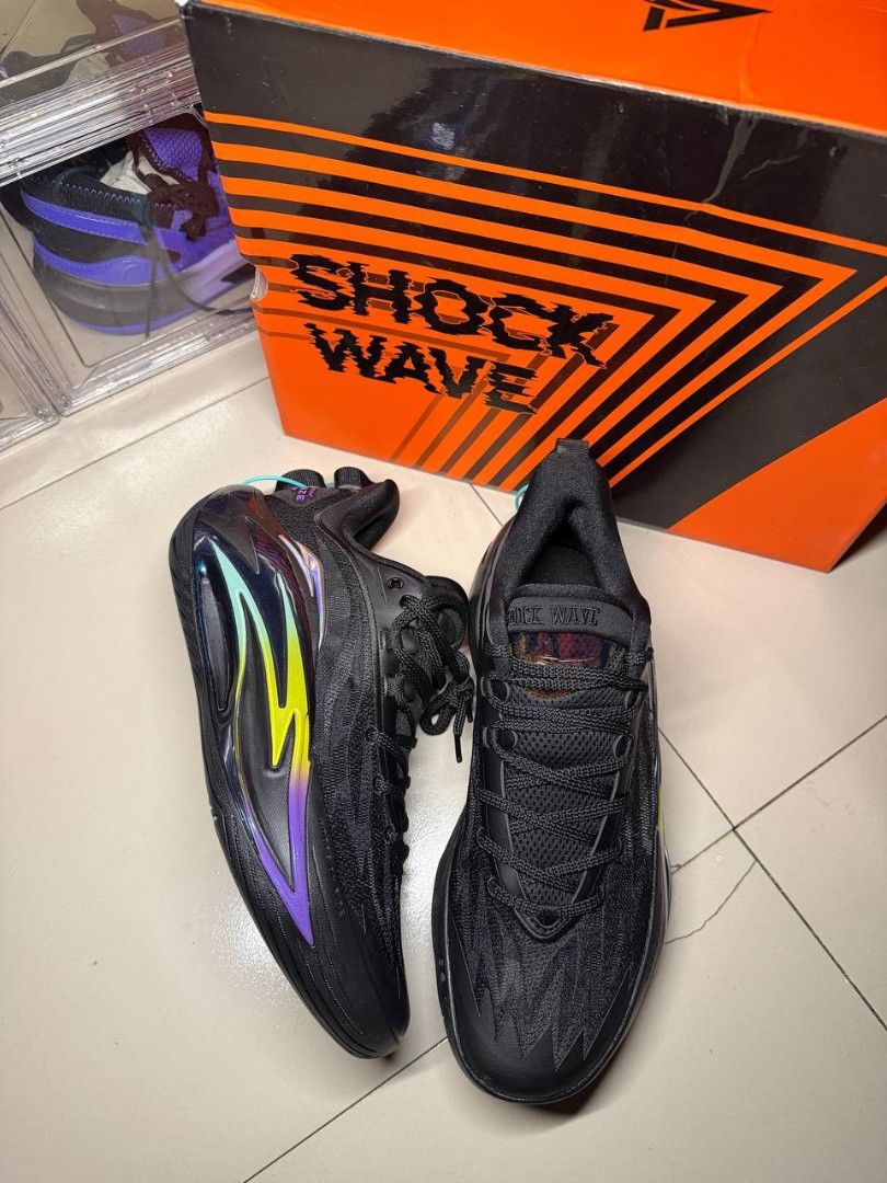 Anta Shock Wave Basketball Shoes (Category: Sneakers) located in Davao. Submitted by jgornez1539244 (Listing ID 1464555939, Image 2). Description: - Black Anta Shock Wave basketball shoes - Features a striking iridescent flame design on the side - Unique tread pattern on the sole for superior grip - Includes original box - Ideal for both basketball performance and everyday casual style.