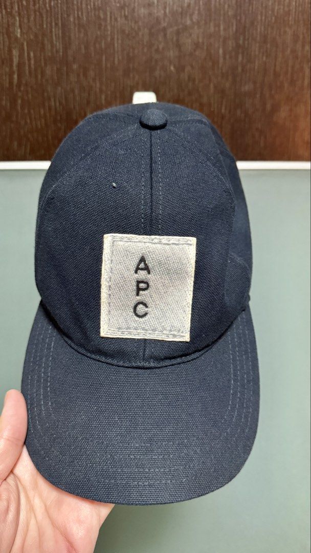 A.P.C. Rue Madame Paris Cap Size 58 (Category: Caps & Hats) located in Mandaluyong City. Submitted by noms11 (Listing ID 1464464700, Image 1). Description: - Navy blue A.P.C. Rue Madame Paris cap - Size: 58 - Features A.P.C. logo on front patch - Adjustable strap at the back for a custom fit - Material: Cotton blend - Made in Vietnam.