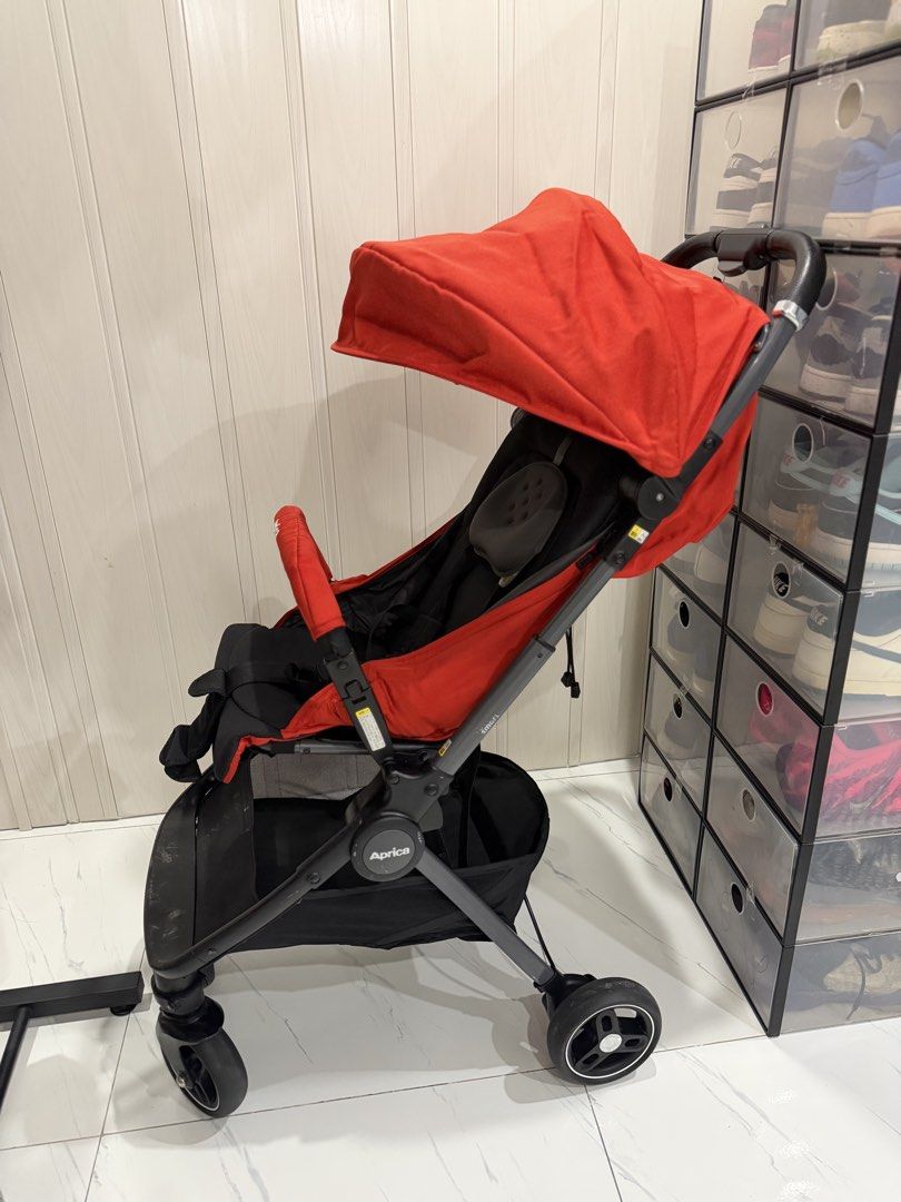 Aprica Nano Red Lightweight Stroller (Category: Strollers) located in Manila. Submitted by sberja07 (Listing ID 1464473865, Image 2). Description: - Aprica Stroller in vibrant Red - Lightweight and incredibly easy to maneuver - Features a protective canopy for sun protection - Convenient storage basket underneath - Folds compactly for effortless storage - Ideal for parents on the go - Ready for its next adventure!.