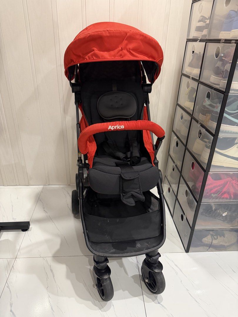 Aprica Nano Red Lightweight Stroller (Category: Strollers) located in Manila. Submitted by sberja07 (Listing ID 1464473865, Image 1). Description: - Aprica Stroller in vibrant Red - Lightweight and incredibly easy to maneuver - Features a protective canopy for sun protection - Convenient storage basket underneath - Folds compactly for effortless storage - Ideal for parents on the go - Ready for its next adventure!.