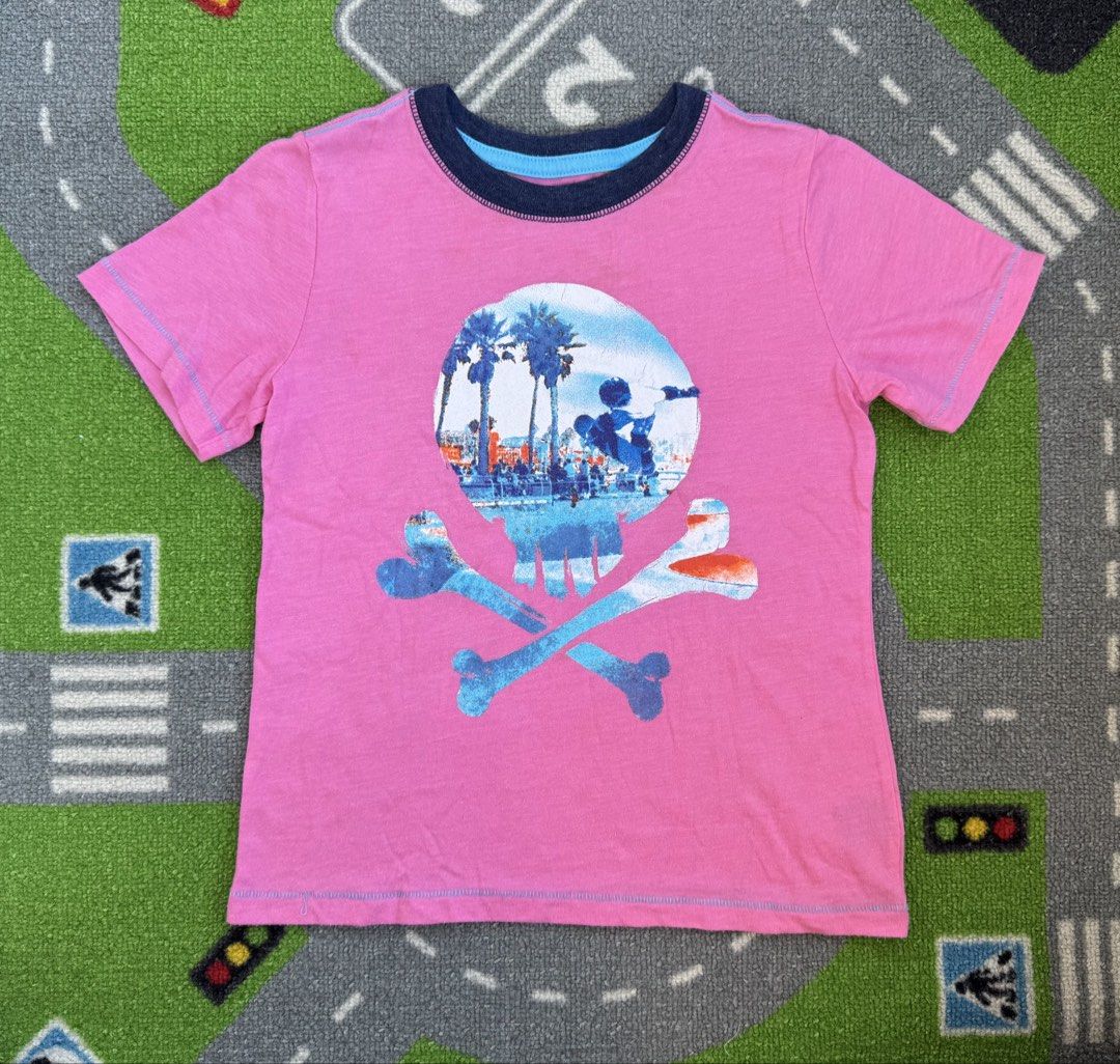 Arizona Shirt (Category: Babies & Kids Fashion) located in Rizal. Submitted by preloovved (Listing ID 1464481701, Image 1). Description: Cool pink t-shirt with a unique skull graphic featuring a beach scene inside. Navy blue neckline trim. Perfect for casual style. Preloved, 6yo Meet-up only in GB1 San Mateo, Rizal Shipping fee c/o buyer. Tres Marias or J&T express Payment to be sent to me via BPI/BDO/GCASH only. 😁 C-2.