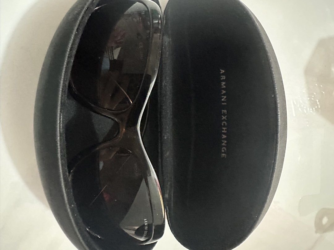 Armani Exchange Sunglasses with Case (Category: Sunglasses & Eyewear) located in Antipolo. Submitted by ririwearph (Listing ID 1464412709, Image 1). Description: - Authentic Armani Exchange sunglasses - Stylish tortoiseshell pattern on frames - Embellished arms with sparkling rhinestones and AX logo - Comes with original hard case - Ideal for sunny weather and adding a touch of glam.