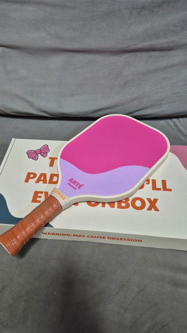 ARTE Pickleball Paddle - Bliss v2 (Category: Racket and Ball Sports) located in Caloocan City. Submitted by greenthumbmnl (Listing ID 1464469085, Image 1). Description: - ARTE Bliss v2 pickleball paddle - Adorable and cute design - Comes with a protective cover - Ideal for playing pickleball - Get ready for your next game with this stylish paddle approx 5 times used only still like new condition.
