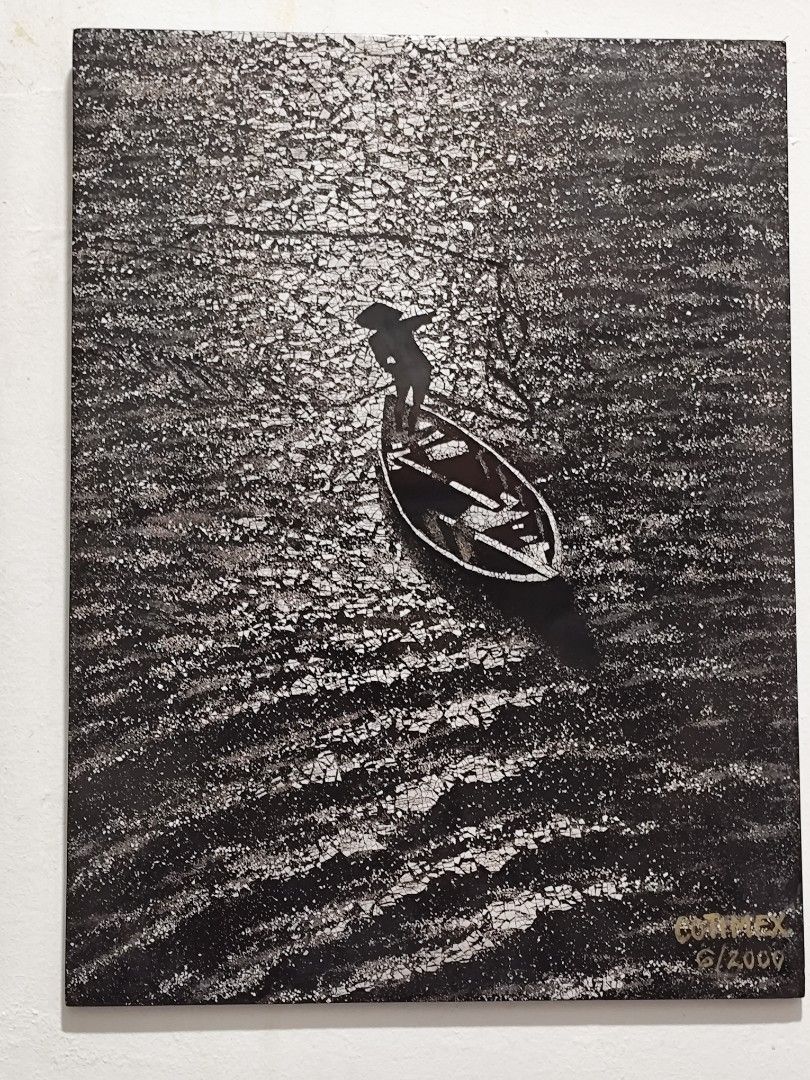 Artwork: Man in Boat, Signed CORIMEX 6/2009 (Category: Art & Prints) located in Manila. Submitted by marriage031073advocate (Listing ID 1464425699, Image 1). Description: - Striking black and white artwork - Depicts a lone figure in a small boat - Unique cracked texture background - Signed by CORIMEX with date 6/2009 - Perfect statement piece for your wall.