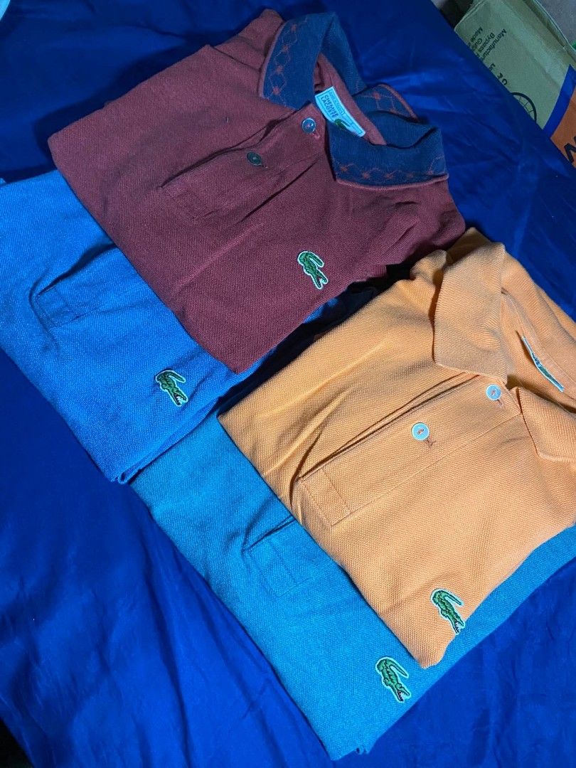ASPACK TAKE ALL LACOS POLO SHIRT (Category: Tshirts & Polo Shirts ) located in Manila. Submitted by trainwreck331 (Listing ID 1464393525, Image 3). Description: ASPACK TAKE ALL FOR ONLY 500 L 28 W 22 - Bundle of 4 Lacoste Polo Shirts - Colors: 1 Maroon, 1 Orange, 1 Blue - Iconic Lacoste Crocodile Logo on each shirt - Ideal for casual outings or sports activities - Excellent value for a set of three.